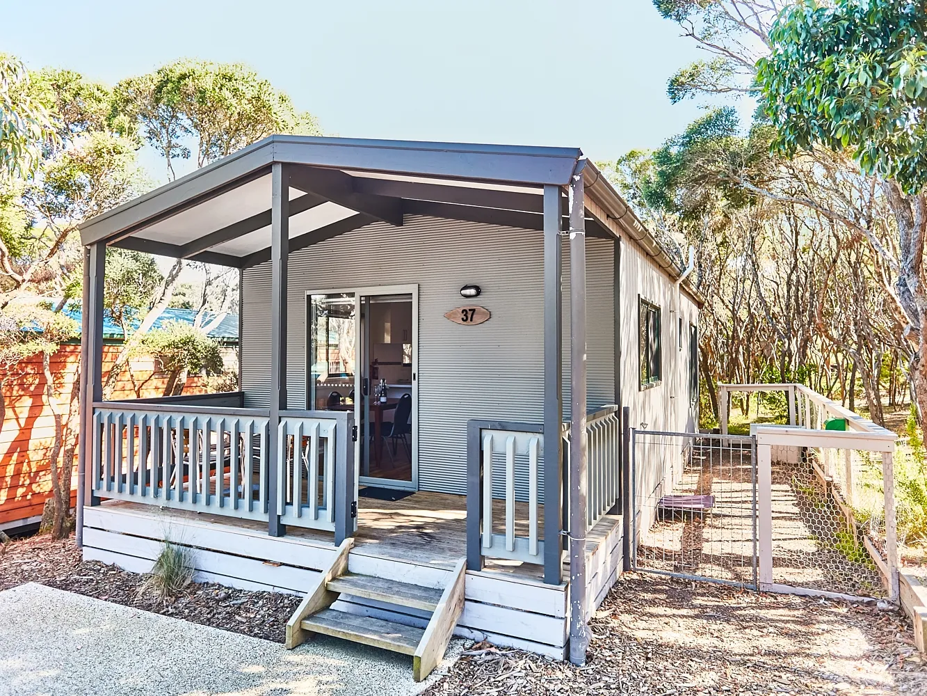 Deck with gate and fenced off dog area