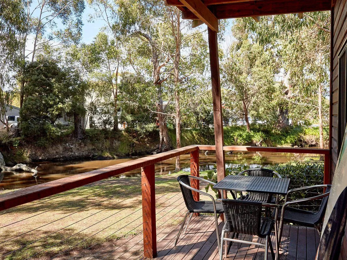 Deck with river view and outdoor furniture