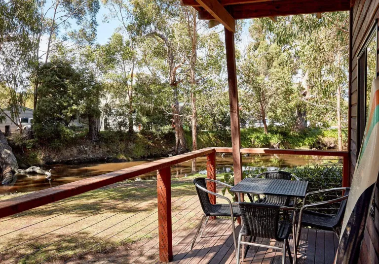 Deck with river view and outdoor furniture